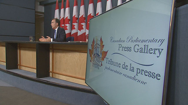 Finance Minister Bill Morneau holds a news conference to discuss Kinder Morgan earlier in May. 