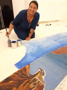 Jori Cachene at work with a painted tipi. Photo courtesy: FNUC. 