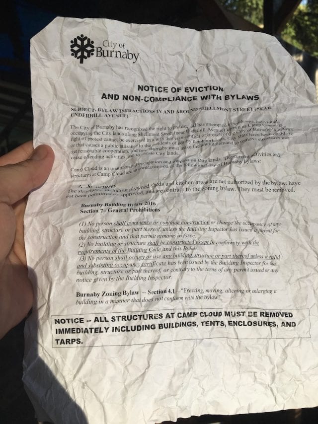 <em style="font-size: 16px;">A copy of the July 18 eviction notice given to Camp Cloud water protectors by the City of Burnaby. Photo: Justin Brake/APTN)</em>